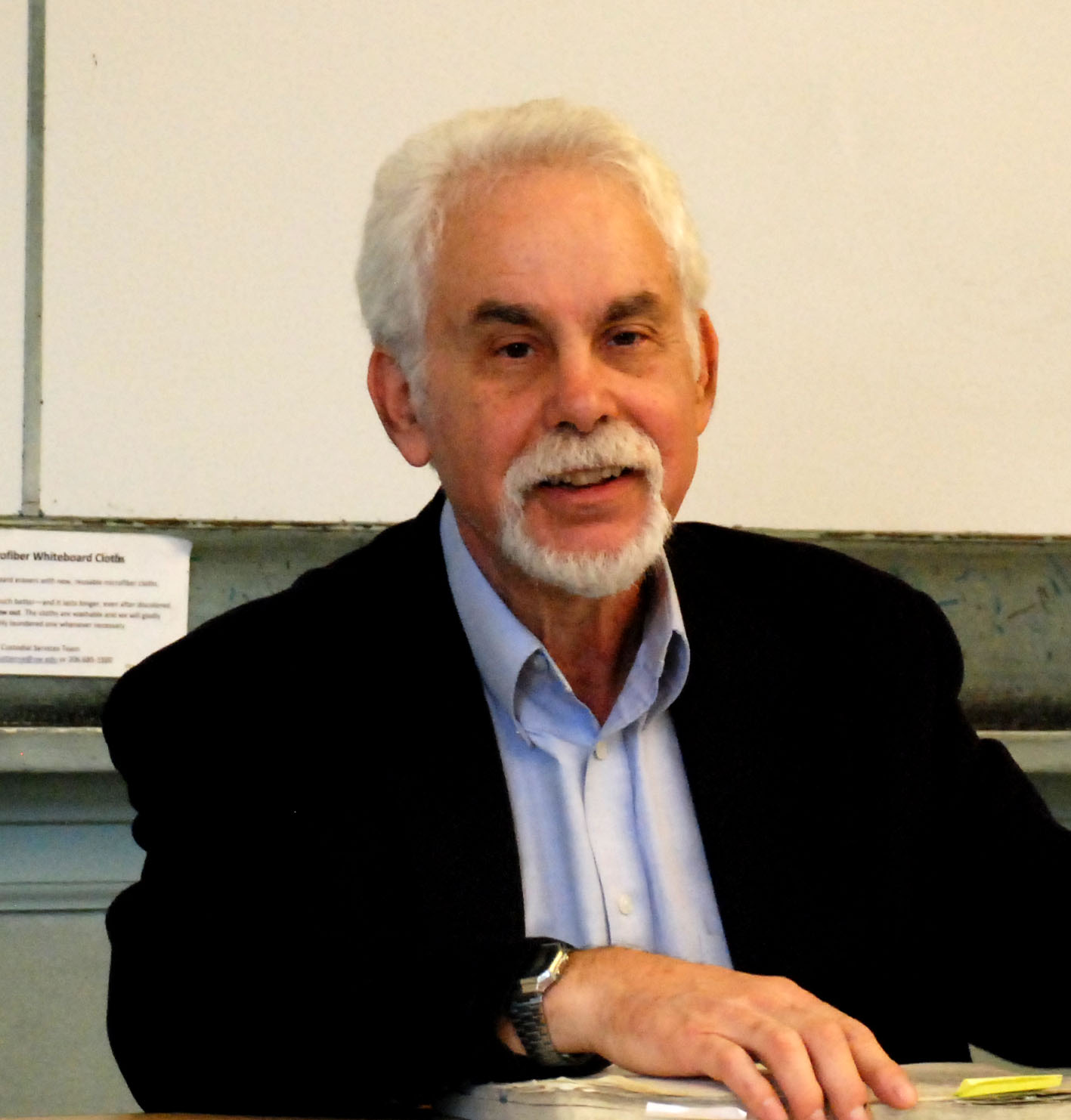 Richard Salomon looks into the camera while siting at a desk.