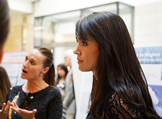 UW graduate student Angela Durán Real and South Seattle College instructor Asha Tran at a research symposium