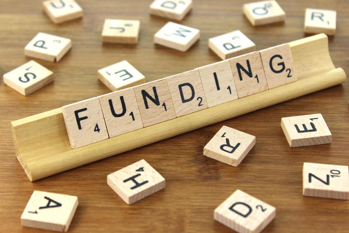 Scrabble tiles spelling funding