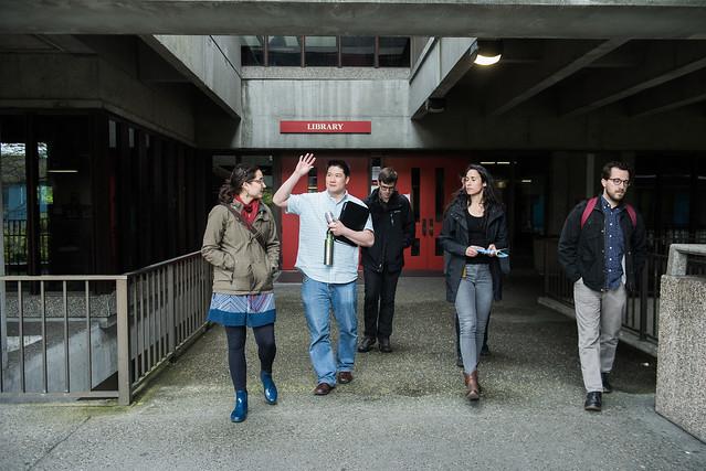 Students leave a library on a community college campus.