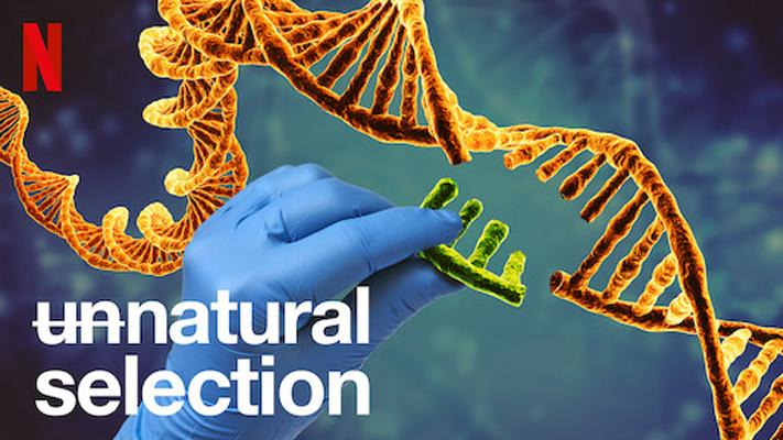 Title card for the Netflix documentary Unnatural Selection. In the background a gloved hand takes a section out of a DNA double helix