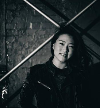 A black and white portrait of Sarah Choi.