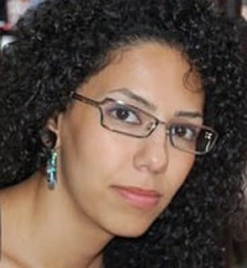Portrait of Solmaz Shakerifard wearing glasses.