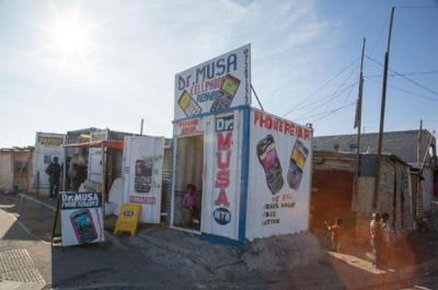 Cellphone Repair Shop built from Shipping Container, Joe Slovo Park, Cape Town, South Africa (Wikimedia Commons)