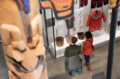 Two people look at a museum exhibit.