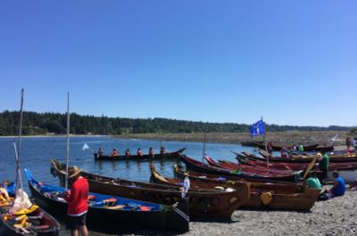 Canoe families request permission to come ashore to the Port Gamble S'Klallam Tribe during the 2018 Power Paddle to Puyallup Canoe Journey.