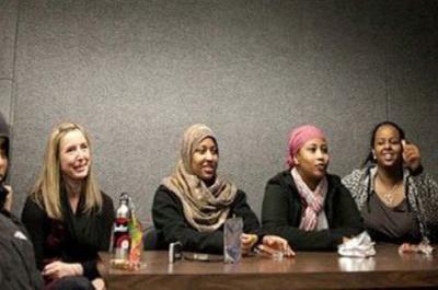 Several people sitting around a table