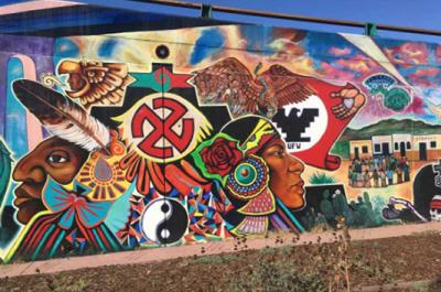 "Quetzalocoatl" is the first collective mural painted in Chicano Park, San Diego, in 1973. The artists, Guillermo Aranda, Salvador Barrajas, Jose Cervantes, Sammy Llamas, Bebe Llamas, Victor Ochoa, Ernest Paul, Arturo Roman, Guillermo Rosete, Mario Torero, and Salvador Torres, unify mythical images grounded in Indigenous stories of the southern California border region. Photo courtesy Lydia Heberling