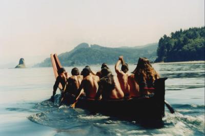 group canoing on the coast