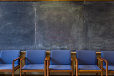 chairs against a blackboard