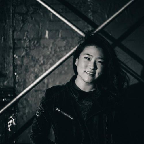 A black and white portrait of Sarah Choi.