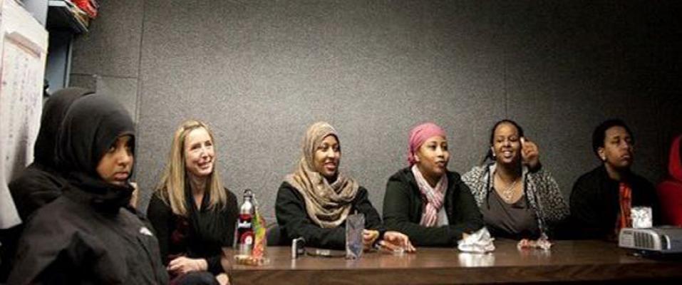 Several people sitting around a table