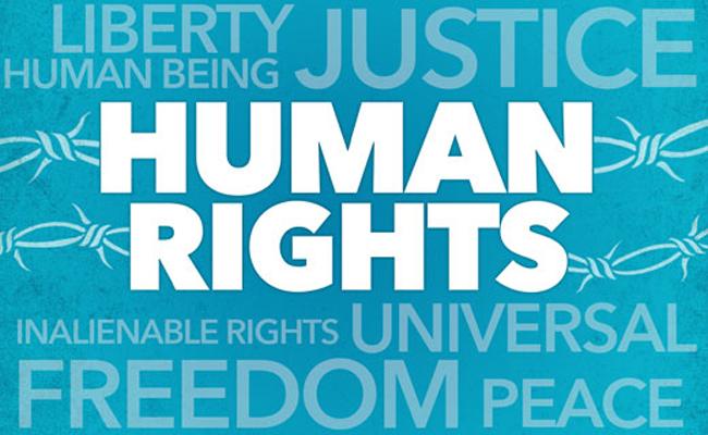 White text reading "Human Rights" set against a blue background made up of associated words like "Freedom" and "Justice"