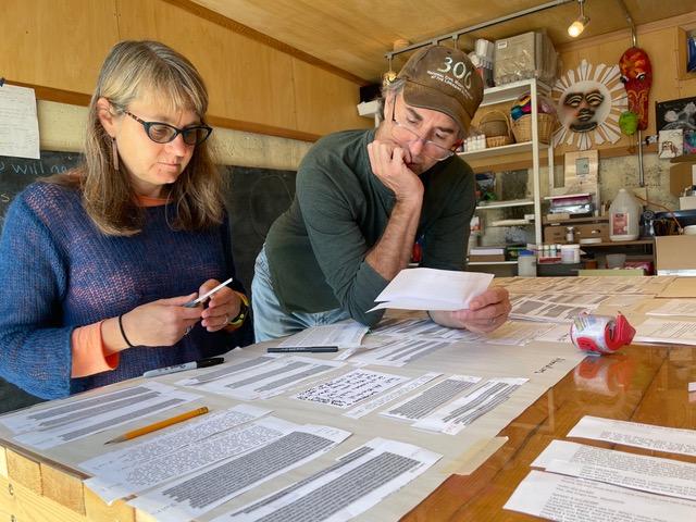 Project leads Lynn and Danny working together at a table