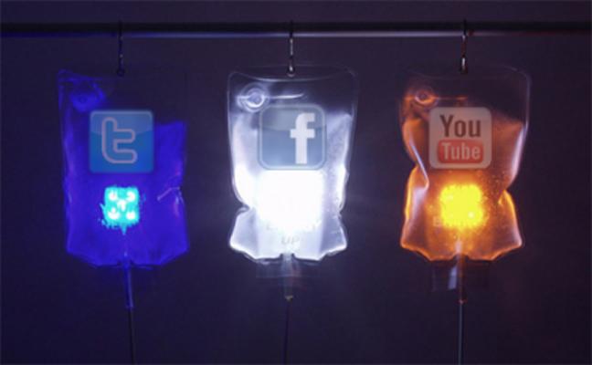 Colored IV bags with the logos of popular social media sites: Twitter, Facebook, and YouTube