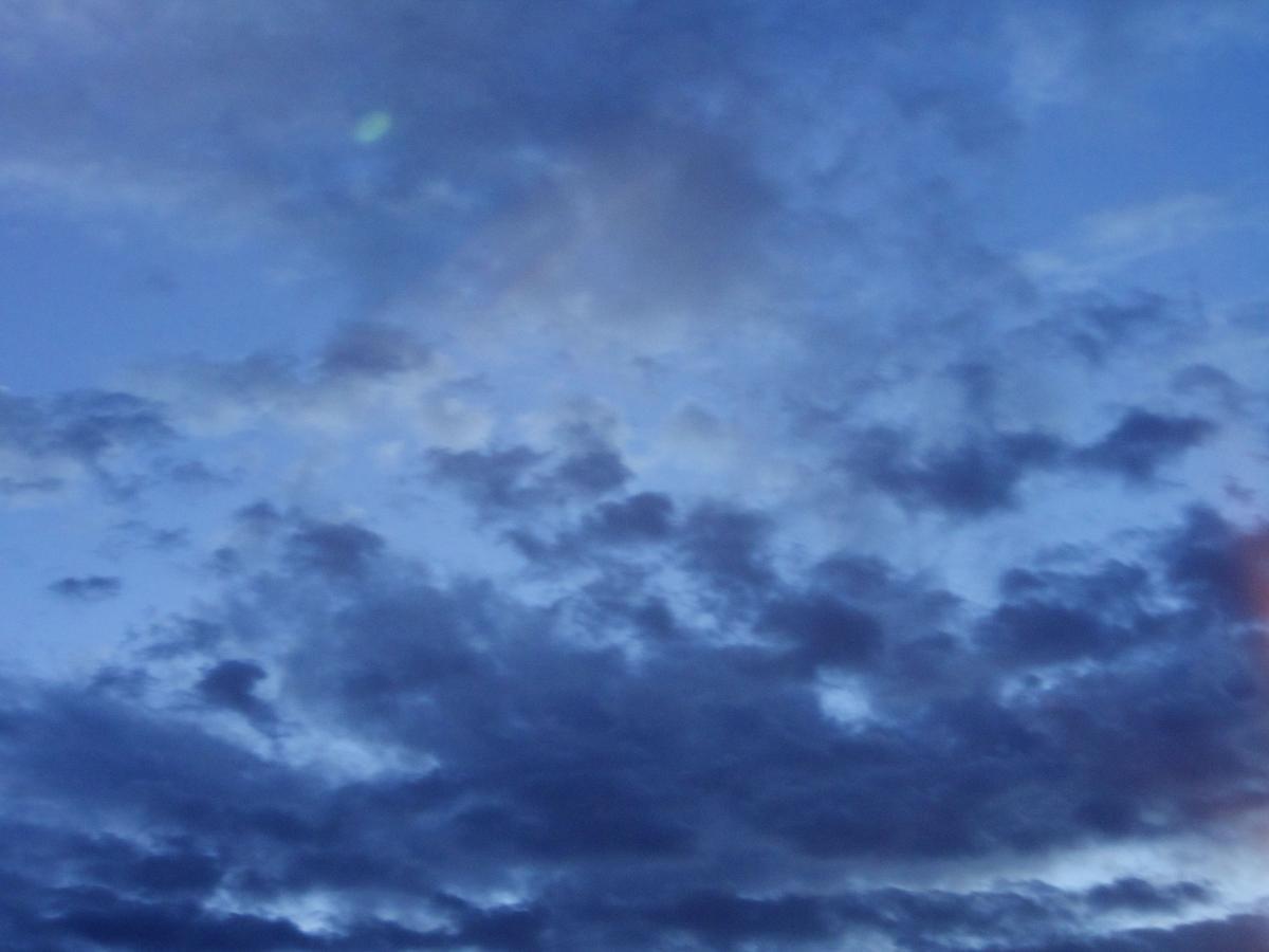 A photo of the sky with dark clouds.