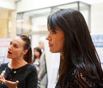 UW graduate student Angela Durán Real and South Seattle College instructor Asha Tran at a research symposium