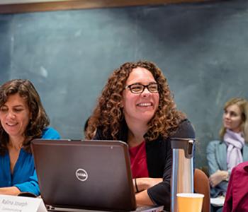 UW faculty Ralina Joseph and Sonnet Retman sitting at a meeting of Women Investigating Race, Ethnicity, and Difference