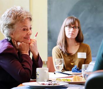 Stephanie Coontz talking to graduate students at the Simpson Center for the Humanities.