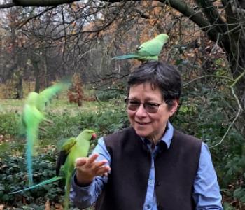 Image of Anna Tsing with birds outside