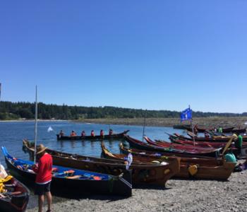 Canoe families request permission to come ashore to the Port Gamble S'Klallam Tribe during the 2018 Power Paddle to Puyallup Canoe Journey.