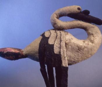 Felted Swan by Pazyryk Culture. 5th - 4th century BCE. Shades of blue in the background with a swan made of felt in the foreground.