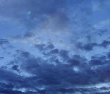 A photo of the sky with dark clouds.